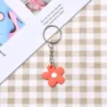 Portachiavi fiore arancione carino con design alla moda, ideale come ciondolo per borsa elegante. - Stile Cerchio Argento / Fiore arancione