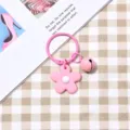Simpatico portachiavi con fiore rosa e campanella colorata per decorare borsa da donna alla moda. - Stile con campanellini / Fiore Rosa