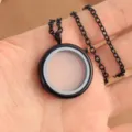 Black round magnetic glass locket pendant necklace, elegant metal chain jewelry detail. - Cross Chain 60cm / Black