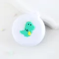 Mini brosse a coussin d'air pliante portable avec miroir, design de dinosaure vert mignon. - Brosse à cheveux petit dinosaure