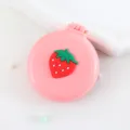 Jolie brosse à cheveux pliante rose avec miroir et design fraise 3D pour un usage quotidien. - Peignes à cheveux fraise