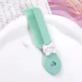 Cute green plastic hair comb for kids with adorable cat design portable mini styling tool - Kitten with Paw Prints