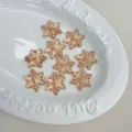 Cuentas de acrílico rosa translúcido en forma de copo de nieve para manualidades DIY. - Café Claro