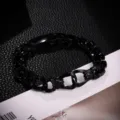Bracciale da uomo in metallo nero con ritratti totem vintage e fibbia a forma di 8 unica. - Nero