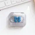 Transparante contactlensdoosje met blauwe strik, schattige draagbare verzorgingscontainer. - Groene brillenkoker met strik
