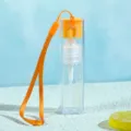 Flacon pulvérisateur en plastique transparent couleur bonbon 10ml avec lanière orange voyage. - Style bracelet cordon / Orange
