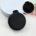 Mini brosse à cheveux pliante portable avec miroir, peigne de massage coussin d'air rond noir. - Peignes noir mat