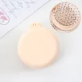 Brosse a cheveux pliante portable avec miroir, mini brosse coussin ronde pour voyage. - Peignes jaune crème mat