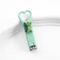 Tagliaunghie verde carino con dinosauro e manico a cuore, mini tagliaunghie portatile. - Tagliaunghie a dinosauro