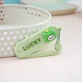 Mignon peigne pliant portable couleur bonbon avec poupée grenouille et imprimé lucky pour frange. - Brosse à cheveux grenouille