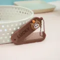 Peigne à cheveux pliant marron portable avec jolie poupée de dessin animé, mini brosse. - Peigne à cheveux ours
