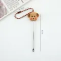 Simpatico pulisciorecchie cucciolo di cartone con catena, strumento in metallo utile. - Pulisci Orecchie / Stile Catena a Sfere / Marrone