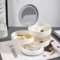 Boîte à bijoux rotative multicouche avec miroir, organisateur blanc pour boucles d'oreilles. - Blanc