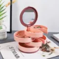 Boîte de rangement de bijoux rotative multicouche rose avec miroir pour boucles d'oreilles. - Rose