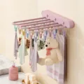 Wall-mounted folding clothes drying rack with 24 clips, pink plastic laundry organizer for bathroom. - 1 Piece/Pack / Peach Pink