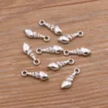 Silver tone conch shell charms zinc alloy pendant DIY jewelry accessories detail view. - Antique Silver