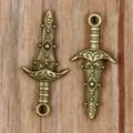 Vintage bronze alloy sword dagger charms for DIY jewelry making, ideal for unique handmade crafts. - Antique Bronze