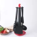 Set de utensilios de cocina de silicona con soporte, espátula resistente al calor y antiadherente. - Juego de 7 piezas / Negro