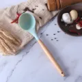 Blue silicone soup ladle with wooden handle, heat-resistant kitchen utensil for non-stick cookware. - Blue Spoons