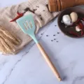 Silicone slotted spatula with wooden handle, heat-resistant kitchen cooking tool for non-stick cookware. - Blue Slotted Turner