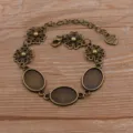 Bracelet DIY en alliage bronze vintage plateau ovale 13x18mm breloques florales variante - Style 7 (Fleur Ajourée) / 13x18mm / Bronze Antique