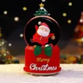 Weihnachtsschneekugel Spieluhr mit Weihnachtsmann und festlicher Dekoration für Geschenke. - Groß 100 Schnee+Licht+Musik / 2062 Stehender Stern Hut