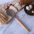 Brown silicone kitchen spatula with natural wooden handle for non-stick cookware cooking tool - Turner