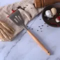 Brown silicone slotted spatula with wooden handle for non-stick cookware kitchen cooking tool item - Slotted Turner