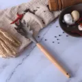 Brown silicone pasta server with wooden handle, heat-resistant kitchen utensil variant. - Spaghetti Server