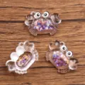 DIY transparent resin crab pendant charms with glitter, perfect for handmade necklaces and bag accessories. - Purple