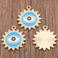 Detail view of round evil eye enamel metal alloy pendant charms for DIY jewelry making. - Blue