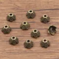 Antique bronze flower bead caps alloy spacer beads for DIY handmade bracelets necklaces jewelry. - Hollow Flower Style (1686) / 5x7mm / Antique Bronze