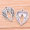 Detailed close-up of antique silver heart wing alloy charms, perfect for DIY jewelry making. - Angel Wing / 16x20mm (1.3g) / Silver