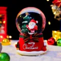 Christmas snow globe desktop decoration featuring Santa Claus and glowing light effects. - 5030 Santa Style / Large 100 Snow+Light+Music