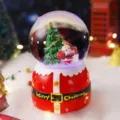 Weihnachts-Schneekugel Ornament leuchtende Spieluhr festliche Tischdeko Geschenke - 2041 Weihnachtsmann mit Geschenkanhänger