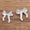 Stainless steel bow pendant for DIY jewelry making, silver color necklace earring charm variant. - Style 965 Bowknot / 22x24mm / Silver