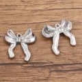 Stainless steel bow pendant charm variant for DIY jewelry making and necklace accessories. - Style 966 Bowknot / 17x19mm / Silver