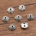 Antiek zilveren bloem kralenkapjes voor het maken van DIY sieraden en onderdelen. - Kraalkap met Reliëfpatroon (4040) / 3x7mm / Antiek Zilver