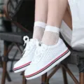 White fishnet ankle socks paired with stylish casual sneakers, perfect for daily trendy wear. - One Size / White Ankle Socks
