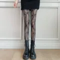 Black floral lace fishnet tights for women, sheer pantyhose with stylish pattern. - One Size / Black