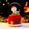 Christmas snow globe ornament detail, cute Santa Claus and rotating glitter design for holiday decor. - Old Man with Gift (2207)