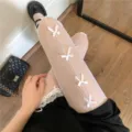 White fishnet pantyhose with cute bows, sweet Lolita style tights for women daily wear. - One Size / Multiple Bows [White]