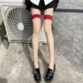 Sexy sheer nude over-the-knee stockings with bold red top bands and chunky black loafers. - One Size / Nude Sheer with Red Trim