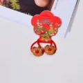 Close-up detail of cute Christmas reindeer hair ties with festive red bands and holiday charm. - Christmas Bear Head Hair Tie Pair
