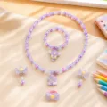 Close-up details of cute children's unicorn pendant and purple pearl jewelry set display. - Unicorn Set / Clear Bag Packaging / Light Purple