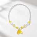 Delicate beaded necklace detail featuring a cute gradient fish tail pendant and pastel beads. - 1 Piece/Pack / Clear Bag Packaging / Yellow