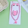 Cute kids pink pearl necklace bracelet earrings set with lovely flower charms detail view - Pink Five-Petal Flower 5-Piece Set (Cardboard Pack)