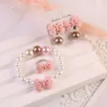 Kids pink bow pearl jewelry set detail, including cute clip earrings, bracelet and lovely ring. - 5-Piece Set (Transparent Bag) / Pink Coffee