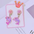 Cute cartoon dolphin clip-on earrings for kids, pink glitter animal design jewelry detail. - Dolphin Carded / Pink Purple