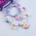 Kids mermaid pearl necklace bracelet set with shell pendant and glitter pouch for girls. - Shell 2-Piece Set (Cardboard) / Purple